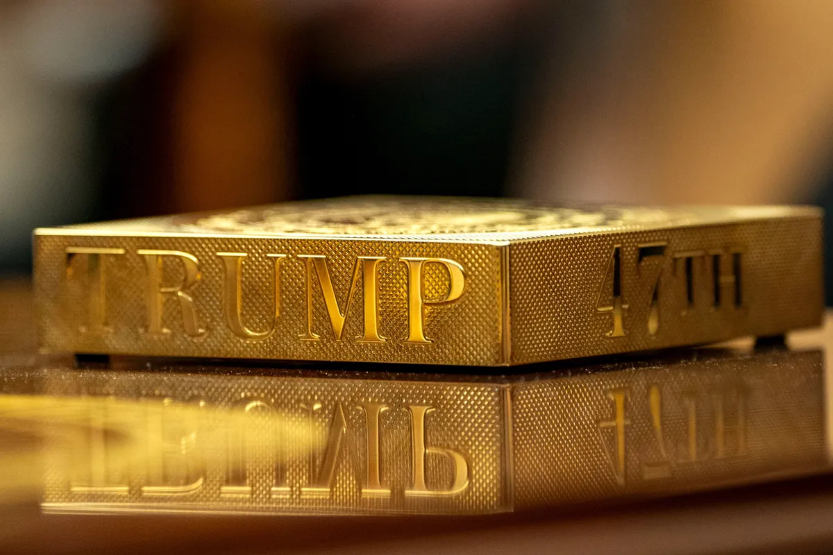 A gold drink coaster on a table in the Oval Office, Washington, 24 February 2025. EPA-EFE/BONNIE CASH