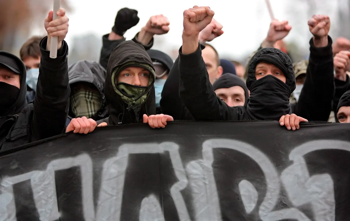 Participants in the now-banned Russian March shout ultranationalist slogans as they march through the centre of Moscow, 4 November 2008. Photo: EPA / YURI KOCHETKOV
