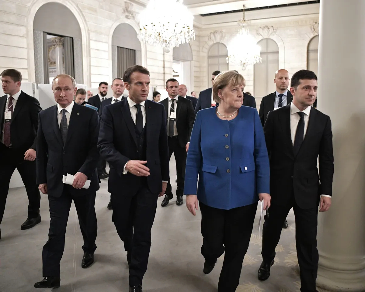 Vladimir Putin (L), French President Emmanuel Macron (2-L), German Chancellor Angela Merkel (2-R) and Ukrainian President Volodymyr Zelensky (R) walk after their talks on Ukraine at the Élysée Palace Palace in Paris, France, 10 December 2019. EPA-EFE/Alexei Nikolsky/Sputnik/Kremlin Pool/Sputnik.